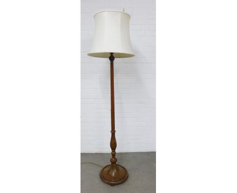 Mahogany standard lamp of fluted design, on a circular base , 188cm high  including shade 