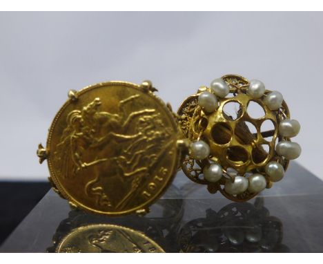 Two large antique 18ct yellow gold rings, one set with a 22ct gold 1915 half sovereign and intricately pierced gallery and th