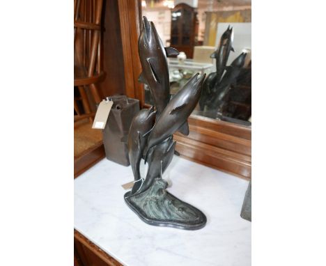 A cast bronze sculpture of four jumping dolphins, H.58cm 