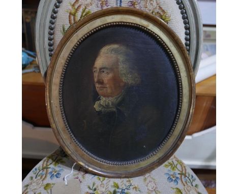 A 19th century gilt framed oval portrait of a gentleman, label verso. H.30cm 