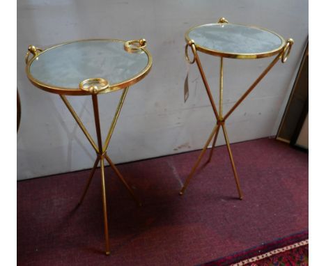A pair of gilt metal lamp tables, with circular mirrored tops on tripod bases, H.77cm Diameter 38cm 