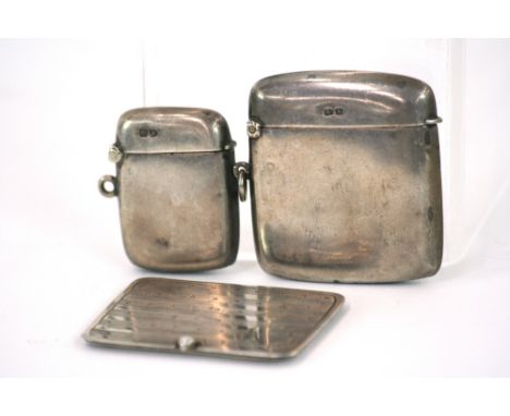 A silver vesta case, Birmingham 1917; a smaller example Chester 1913; and a silver stamp box with engine turned decoration an