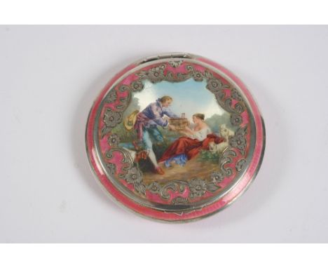 A good quality white metal and pink enamelled circular compact, the hinged lid with chased foliate decoration around a centra