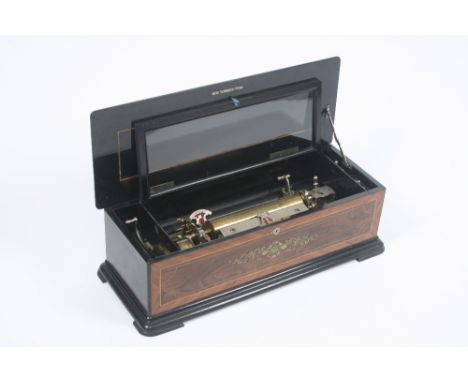 A 19th Century rosewood and inlaid cased Swiss music box, playing six airs, 68cm long; together with a transfer decorated box