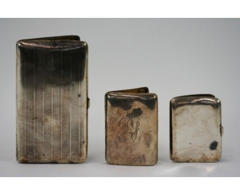 A large silver cigarette case, with engine turned decoration initialled L.M.C. Birmingham 1929; and two smaller silver cigare