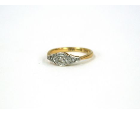 An 18ct gold and three stone diamond ring 