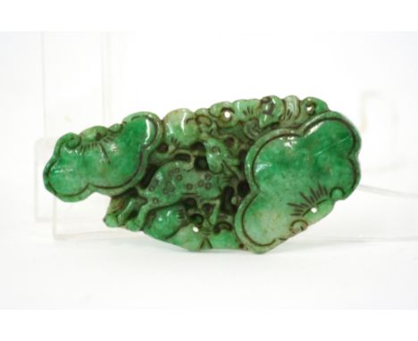 A jade pendant, with floral and animal decoration, 8.5cm long