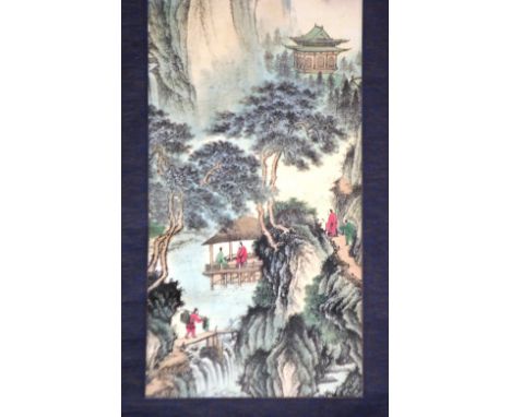 A Chinese scroll painting, by Tang Yan depicting figures and buildings in a ravine, 130cm long overall
