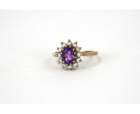 An 9ct gold pearl and amethyst set ring