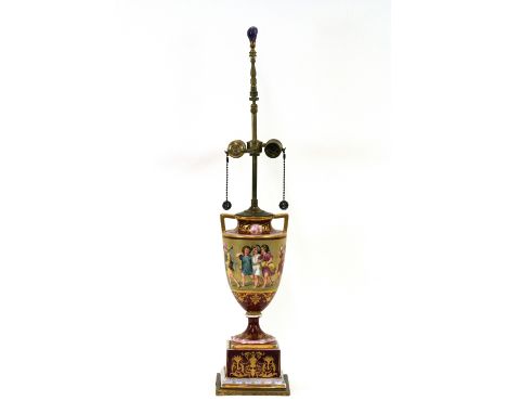 A Vienna porcelain table lamp base, decorated scenes of children and foliage, heightened in gilt, 73cm high overall