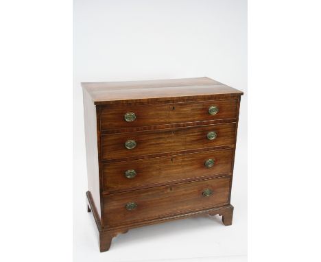 A George III mahogany rosewood and satinwood cross-banded chest, of four long graduated drawers, raised on bracket feet, 94cm