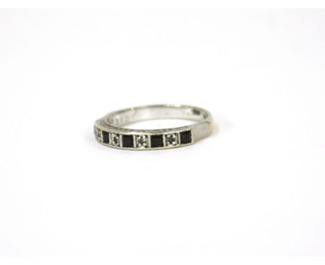 A 9ct white gold amethyst and diamond half eternity ring