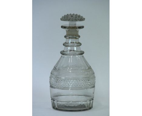 A Georgian glass maul shaped decanter, having hobnail cut decoration, triple ring neck and mushroom stopper, 24cm high 