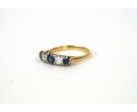 An 18ct gold diamond and sapphire five stone ring 