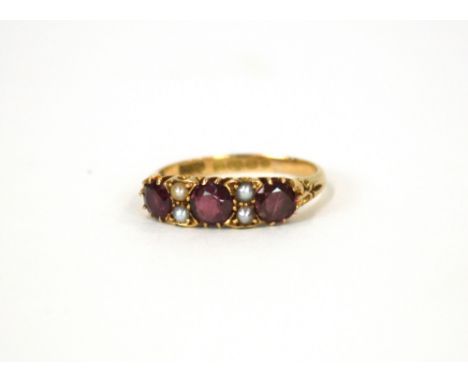 An 18ct gold amethyst and seed pearl dress ring