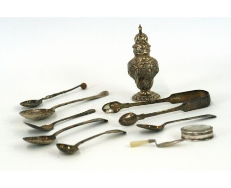 A George III style pepper pot, of baluster shape by E S Barnsley & Co.,Birmingham 1913, wrythen moulded decoration, 10cm high