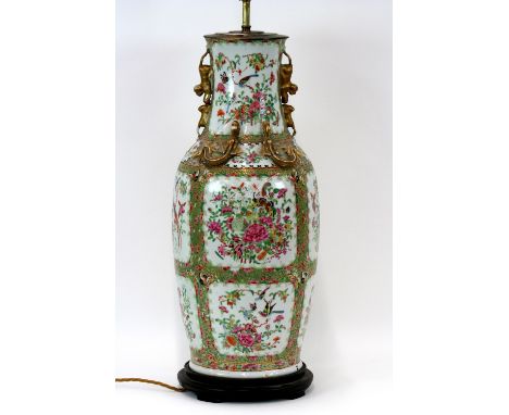 A Canton baluster vase/table lamp, profusely decorated flowers, birds and insects, with raised gilt dragon and Dog of Fo deco