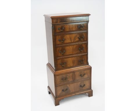 A good quality reproduction mahogany tallboy chest, of small proportions, the upper section fitted four long drawers within b