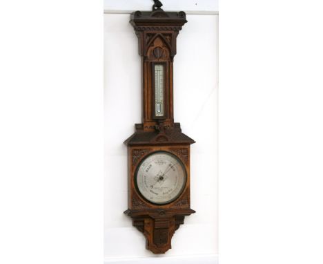 An aneroid oak cased barometer/thermometer, by Negretti & Zambra, London, 100cm