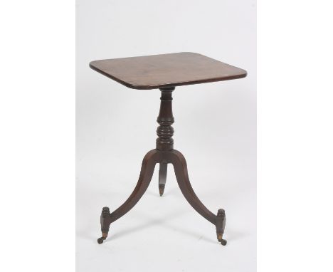 An early 19th Century mahogany tilt top tripod occasional table, raised on a turned baluster column, the supports terminating