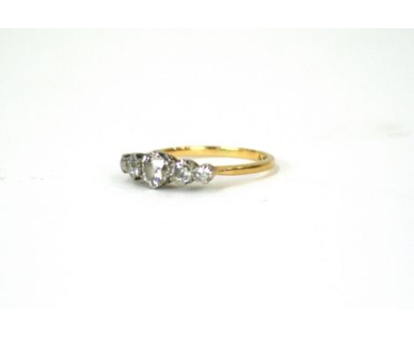 An 18ct gold ring, set five diamonds 