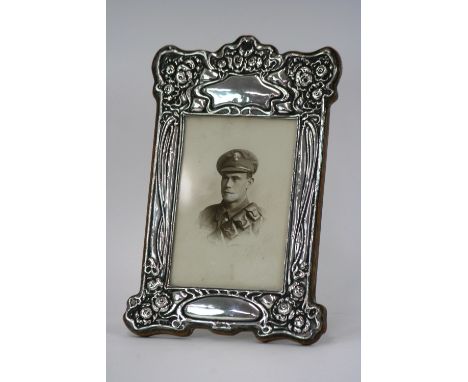 An Art Nouveau silver easel photograph frame, hallmarks for Chester, date letters indistinct, 24cm x 16cm in extremes