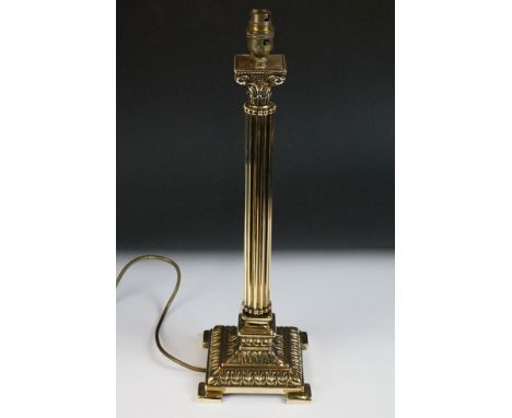 Cast brass Corinthian column table lamp base, raised on four bracket feet, approx 50cm high 