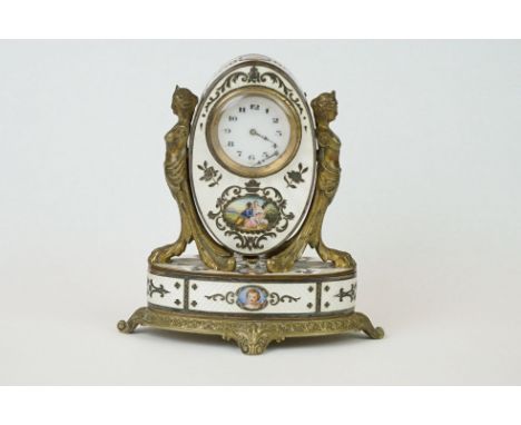An antique Brass and enamel table clock, hinged top reveals trinket box with gilt lined interior, guilloche enamel decoration