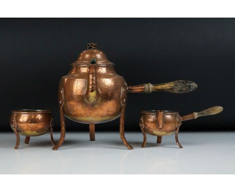 Arts and Crafts hammered copper raised tea set comprising teapot &amp; cover with wooden side handle, jug with wooden side ha