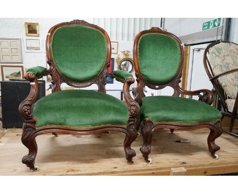 Pair of Victorian His and Hers Parlour Chairs , with foliate scrolling carving and green upholstered seats and backs, both ra