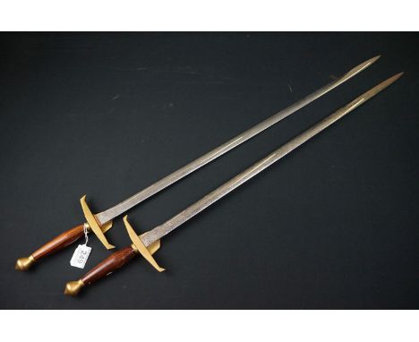 A Pair of Wilkinson Swords with floral decoration with makers mark to blade, 90 cm including handle 