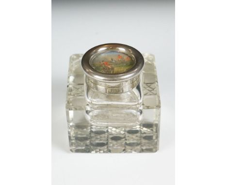 Cut glass inkwell of square form with hand-painted hunting scene to hinged silver plated lid, appears to be signed, measures 