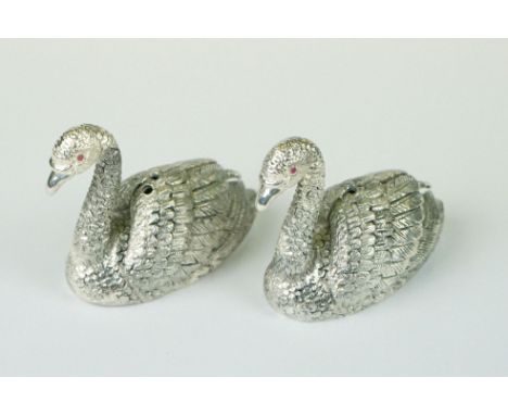 Pair of silver plated condiments in the form of swans with ruby eyes 