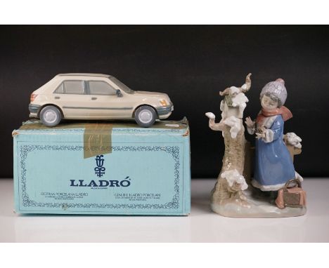 Boxed Lladro 1989 Ford Fiesta porcelain figure, 25.5cm long, (tatty box) together with a Lladro ' Winter Frost ' porcelain fi