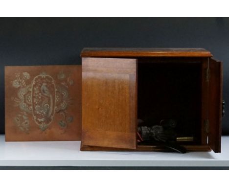 Small wooden cabinet containing two late 19th / early 20th century brass door finger plates, a 19th century copper printing p