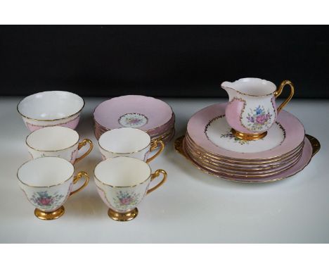 Early 20th Century Shelley hand painted floral tea ware on pink and white ground, with gilt highlights, initialled VR to base