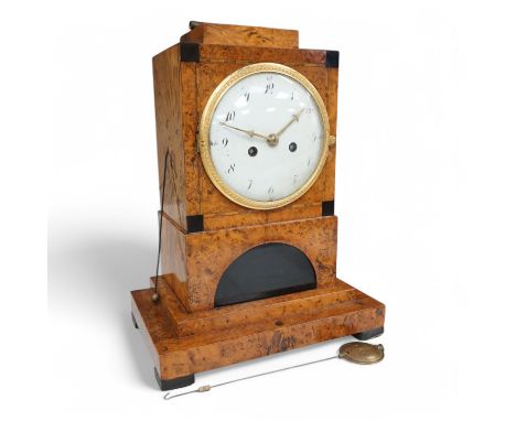 A Biedermeier maple and birds eye maple mantel clock, first half 19th century. 31cm high.