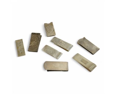 Seven assorted modern silver money clips including engine turned by Alfred Dunhill, Birmingham, 1973, 54mm and samorodok deco