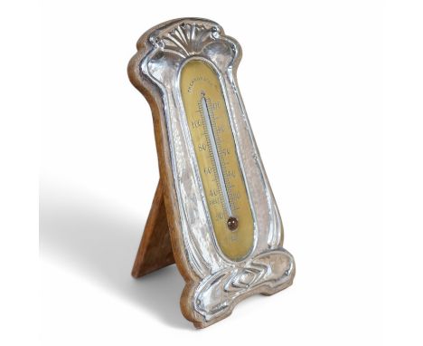 An Edwardian Art Nouveau silver and brass mounted thermometer, makers mark rubbed, Birmingham, 1905, 18.2cm. Condition - poor