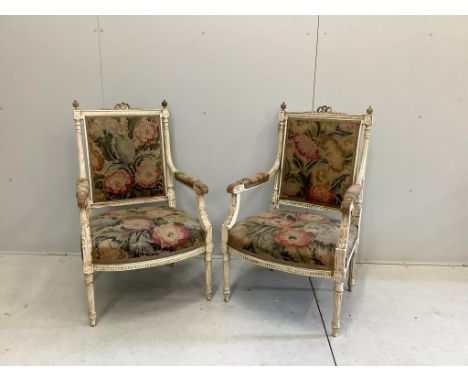 A pair of Louis XVI carved fauteuil, tapestry upholstered seat and back, width 57cm, depth 50cm, height 96cm. Condition - fai