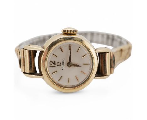 A lady's late 1950's gold plated Omega manual wind wrist watch, with baton numerals, movement c.482, case diameter 17mm, on a
