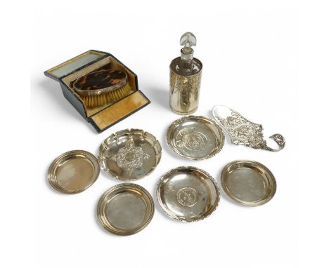 A set of three Elizabeth II small silver nut dishes, Birmingham, 1953, one other silver nut dish, two Chinese coin inset dish