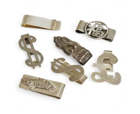 Eight assorted mainly modern novelty money clips including silver pound and dollar sign, sterling dollar sign, sterling Chine