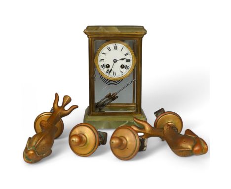 A late 19th century onyx and brass mantel clock together with two brass door knockers in the form of dolphins and two door ha