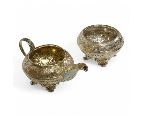 A George IV silver cream jug with foliate scroll decoration, Joseph Angell I, London, 1825, together with a similar sugar bow
