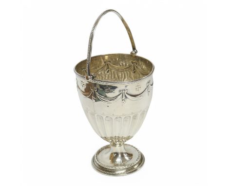 A late Victorian embossed silver vase shaped pedestal sugar basket, by Henry Wilkinson &amp; Co Ltd, London, 1878, height 12.
