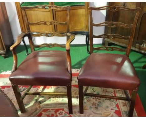A Set of Eight late 19th/Early 20th Century Mahogany and Beech Dining Chairs; each having a pierced ladder back, stuffed seat
