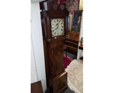 An Early 19th Century Mahogany and Crossbanded Longcase Clock; the painted square dial having date aperture, the hood with sw