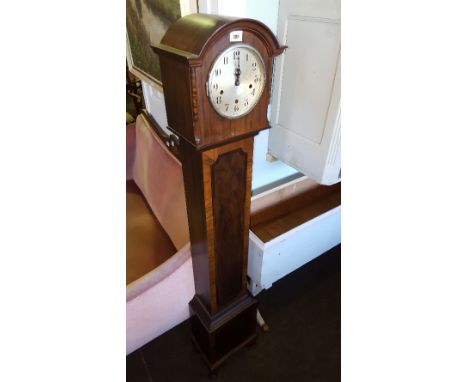 A 1930s Walnut Veneered Grandmother Clock; the silvered dial having Arabic numerals , with striking and chiming movement.