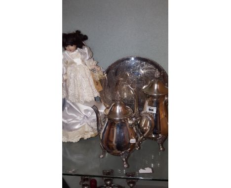 A Musical Bisque 'Waterford' Doll, together with a Sheffield Silver-Plate Tray, and Tea/Coffee Pots.
